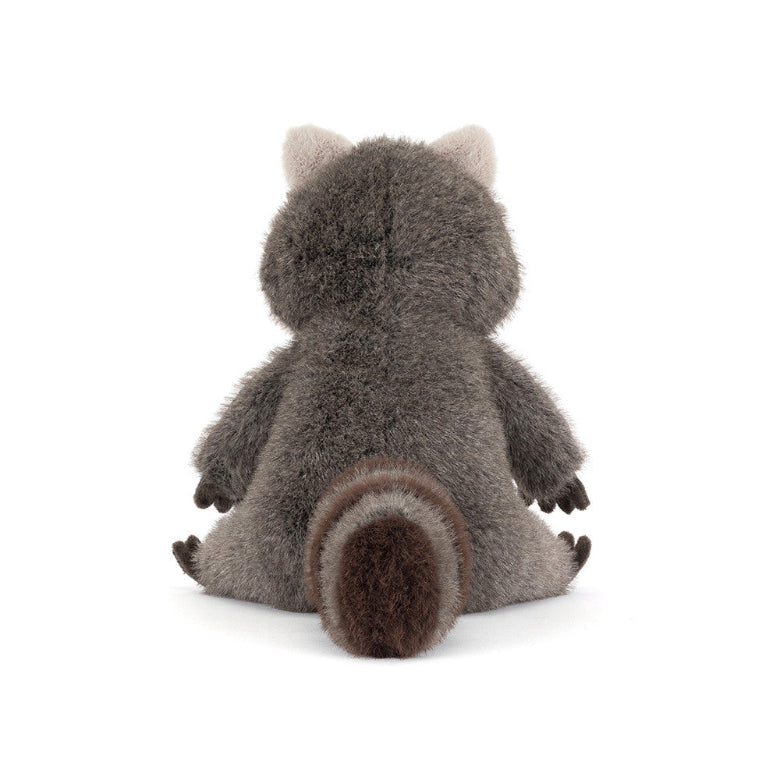 Plush raccoon toy on a white background