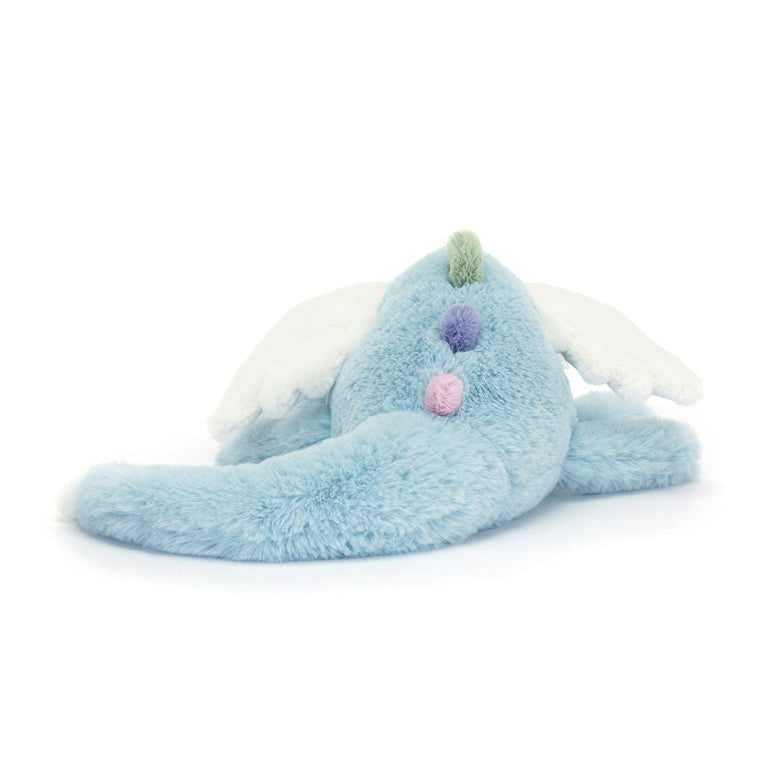 Plush toy resembling a blue creature with white wings on a white background