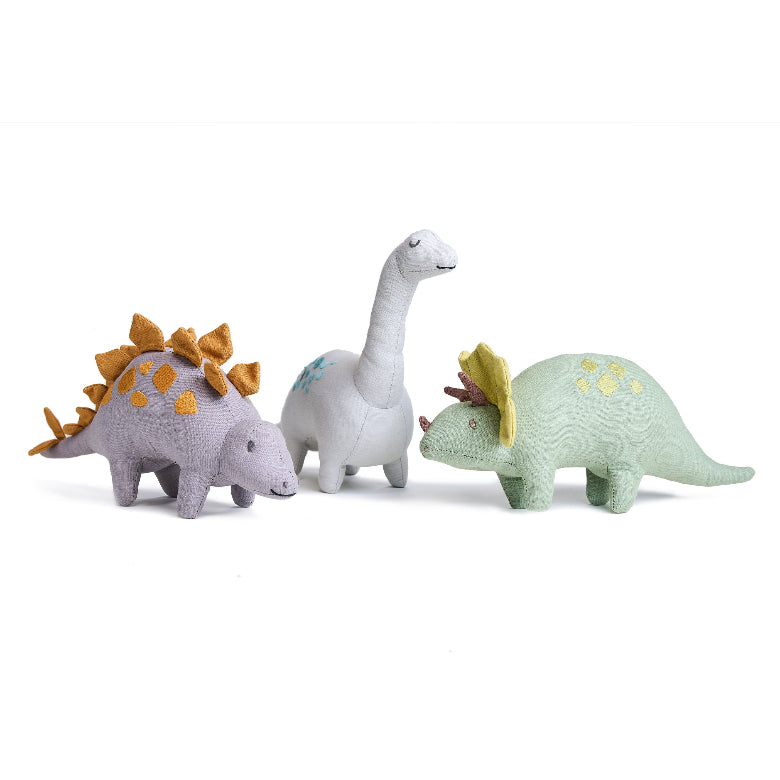 Three toy dinosaurs on a white background