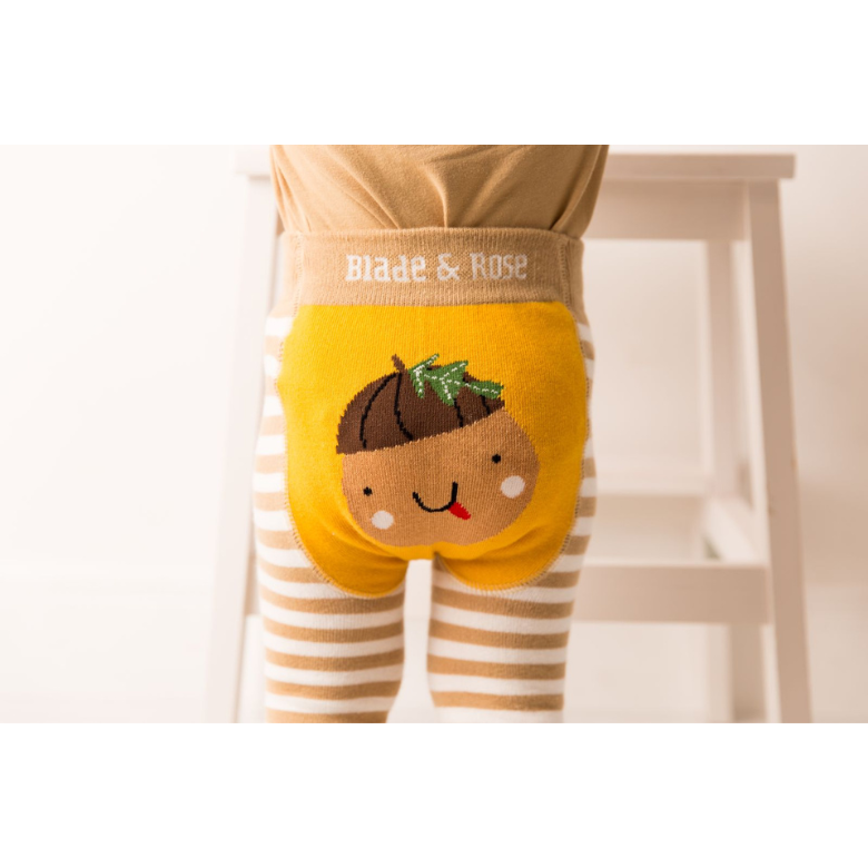 A close-up of a child wearing yellow and beige striped pants with a large embroidered acorn character on the back pocket. The waistband reads 'Blade & Rose'.