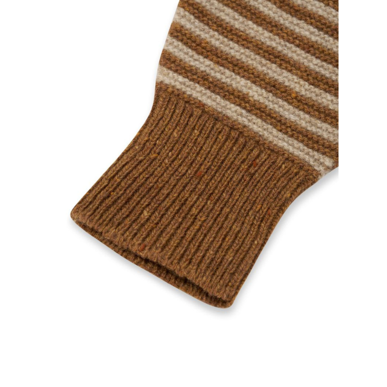 Close-up detail of a striped knit garment, showing a ribbed brown cuff with alternating brown and beige horizontal stripes on a white background.