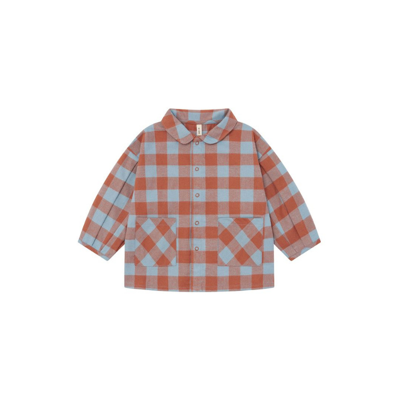 A children's long-sleeve button-up shirt with a light blue and terracotta orange gingham pattern, featuring a Peter Pan collar and two front patch pockets, shown on a plain white background.