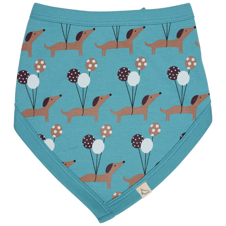 A baby bandana diaper cover in a teal blue color, featuring an all-over print of brown dachshunds holding brown, white, and dark brown polka-dot balloons. The product is laid flat on a clean white background.